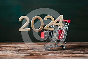 New year 2024 in shopping trolley, online shopping concept