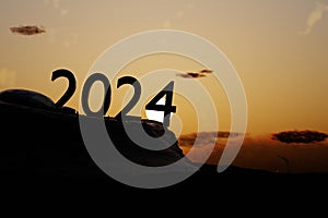 New Year 2024 with Silhouette and sunset background.