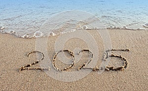 New Year 2025 is coming concept on tropical beach.