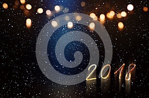 New year background with blue light beam and golden bokeh