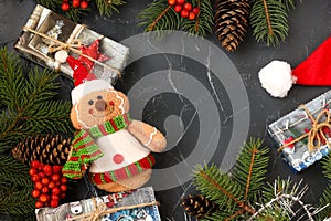 New Year background with a Christmas tree, red cap, cones, garland, gifts, toys and viburnum