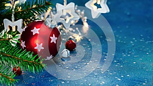 New year background with red ball, christmas jingle bells and lights garland