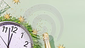 New Year banner with clock, bottle of champagne and glasses