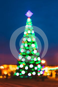 New Year Boke Lights Xmas Christmas Tree And Festive Illumination. Defocused Blue Bokeh Background Effect. Design
