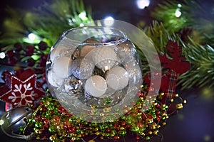 New Year card. Christmas decorations in the glass sphere. Congratulations on the holiday.