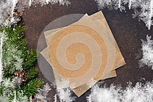 New Year card. Christmas tree with cones on a brown background