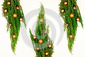 New Year card with Christmas tree and gold decorations on a white background. flat lay. New Year and Christmas, holiday