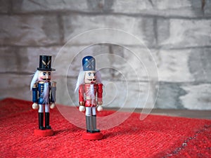 New Year card. Two wooden nutcrackers on a red background