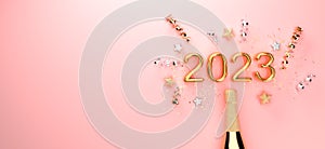 New Year 2023 celebration theme with a champagne bottle with confetti - 3D