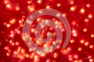 New year and Christmas. abstract background. Glitter and red bokeh lights are out of focus. Celebration of the holiday