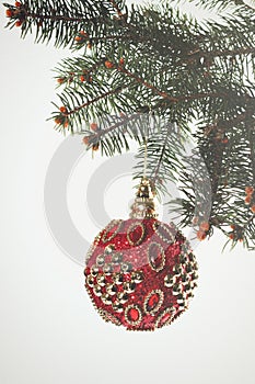 New Year. Christmas. Beautiful round red Christmas toy hanging o