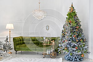 New Year. Christmas. The classic interior of the room is decorated in New Year`s style with a Christmas tree, a sofa