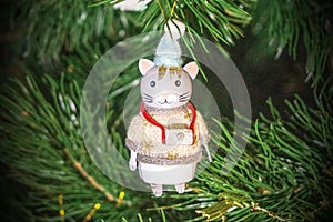 New Year and Christmas concept. Christmas tree decoration - vintage figurine of a cat with a camera.