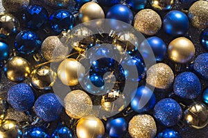New year christmas decoration balls blue gold ball shiny glitter background