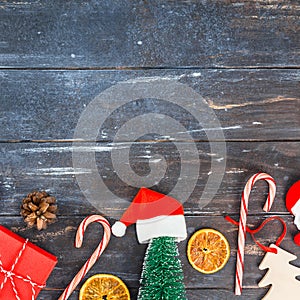 New Year or Christmas decoration flat lay top view Xmas holiday celebration handmade gift boxes on dark wooden background.