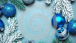 New Year and Christmas decorations, balls and fir tree on blue background