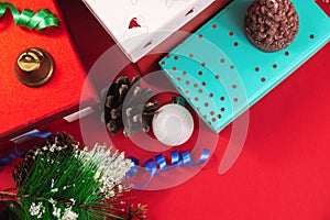New Year and Christmas decorations on a red background, top view, scattered