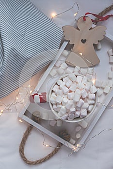 New Year or Christmas flat lay top view with Hot cacao coffee chocolate with marshmallows mug Xmas holiday celebration on wooden