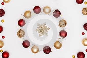 New Year and Christmas frame, greeting card, banner. Red and golden Xmas holiday decorations. Top view, flat lay, copy space