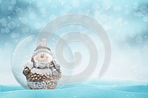 New Year, Christmas magic ball with Snowman. Copy space beside
