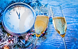 New Year or Christmas at midnight with champagne flutes with gold bubbles