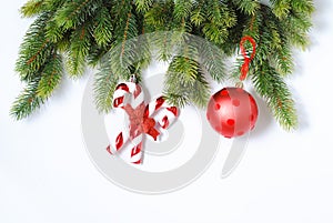 New Year and Christmas mokcup with fir tree branches and red and golden decorations on the white background