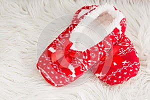 New year, Christmas slippers on white soft fur. Funny, funny, cozy