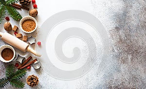 New Year an Christmas stone background with baking ingredients, fir twigs and cones
