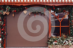 New Year and Christmas-themed backgrounds. Closed roller shutters of Christmas store for text placement