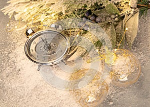 New year clock and cones covered with snow. Christmas and new year`s decor