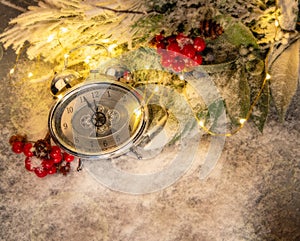 New year clock and cones covered with snow. Christmas and new year`s decor