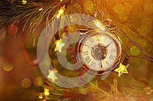 New year clock toy for christmas decoration haning on a Christmas tree