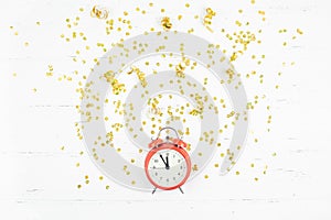 New Year composition alarm clock golden confetti