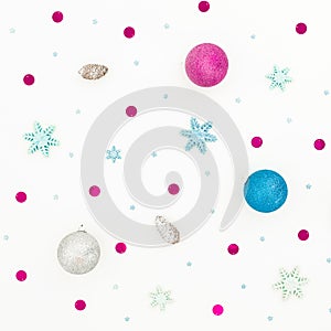 New Year composition with Christmas balls decor and confetti on white background. Flat lay, top view