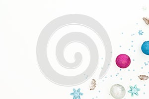 New Year composition with Christmas balls decor on white background. Flat lay, top view