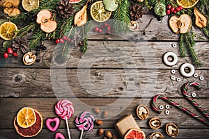New Year composition of dried fruits on a wooden table. Christmas background. Flat lay.Top view