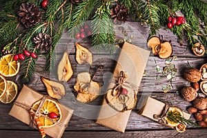 New Year composition of flowers, gifts on a wooden table. Christmas background. Flat lay.Top view