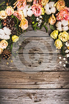 New Year composition of flowers, gifts on a wooden table. Christmas background. Flat lay.Top view