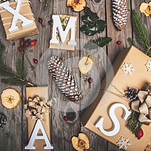 New Year composition of flowers, gifts on a wooden table. Christmas background. Flat lay.Top view