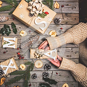 New Year composition of flowers, gifts on a wooden table. Christmas background. Flat lay.Top view
