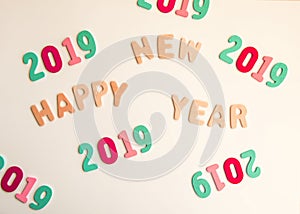 New Year composition with wooden 2019 numbers and letters. Happy New Year festive card.