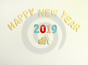 New Year composition with wooden 2019 numbers and letters. Happy New Year festive card.