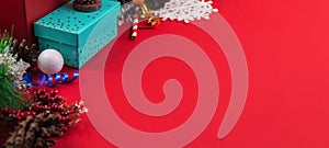 New year concept, border with gift wrapping and decorations on a red cozy background