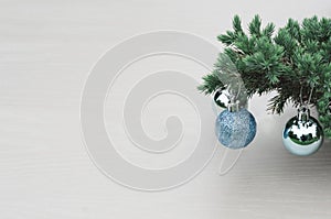 New year concept. Christmas trees with blue balls, Christmas decorations on a light white  background.