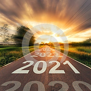 New Year Concept : Empty asphalt road sunset and New Year 2021