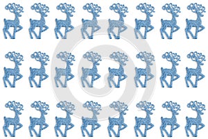 New year concept. pattern of Christmas toys in the form of blue deer color on a white background. top view, flat layout