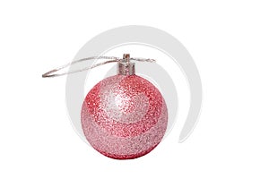 New Year concept. Toy with glitter layer pink on Christmas tree isolate on white