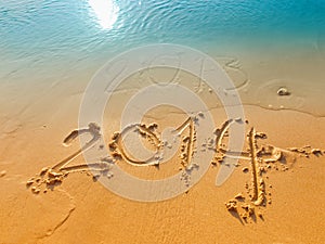 New Year 2014 concept-written in sand on the beach