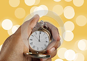 New Year Countdown Concept Golden Antique Watch in a Hand