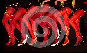 New year dancing composition of seducing women legs with garland illumination